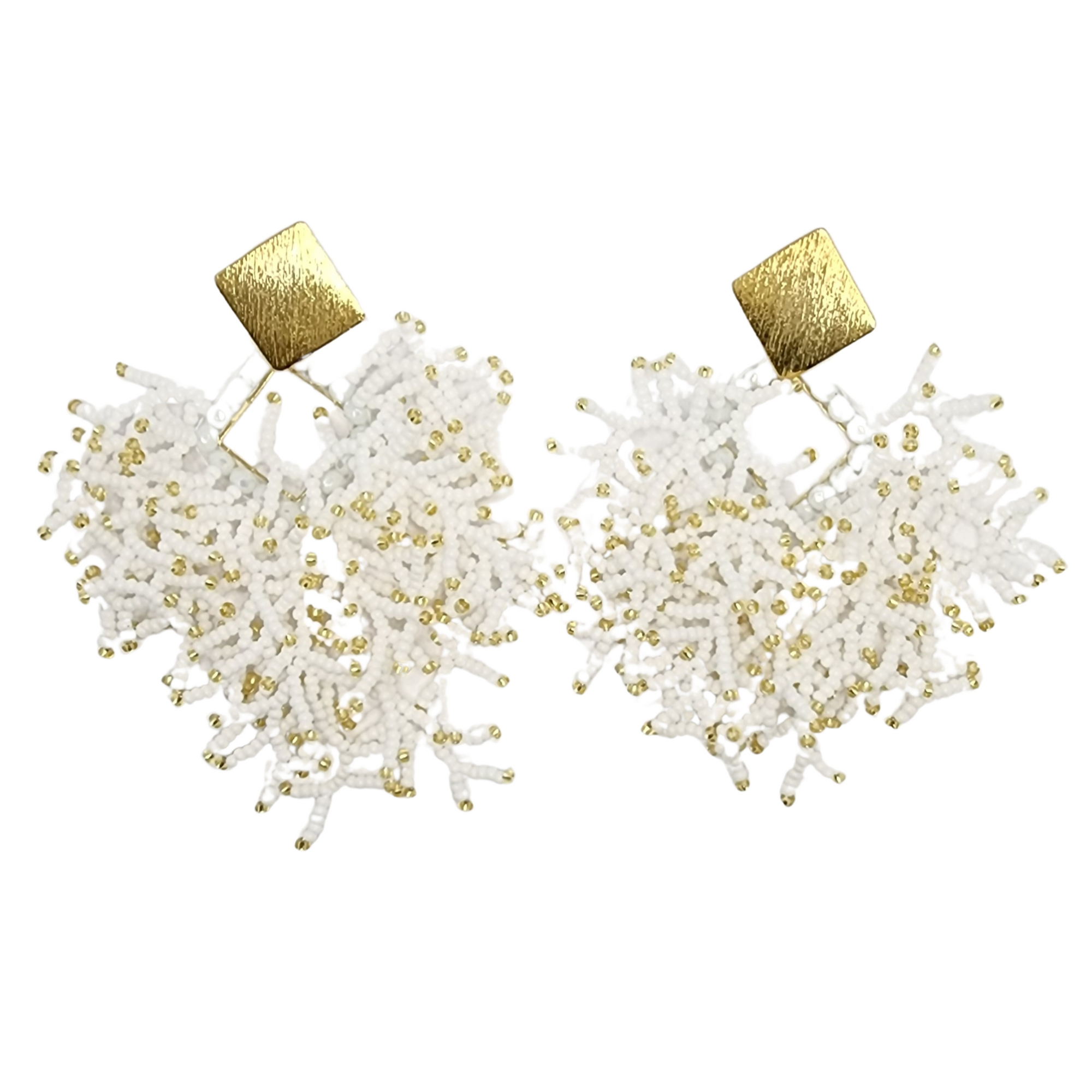 A pair of handmade earrings with white and gold beadwork and textured gold square tops.