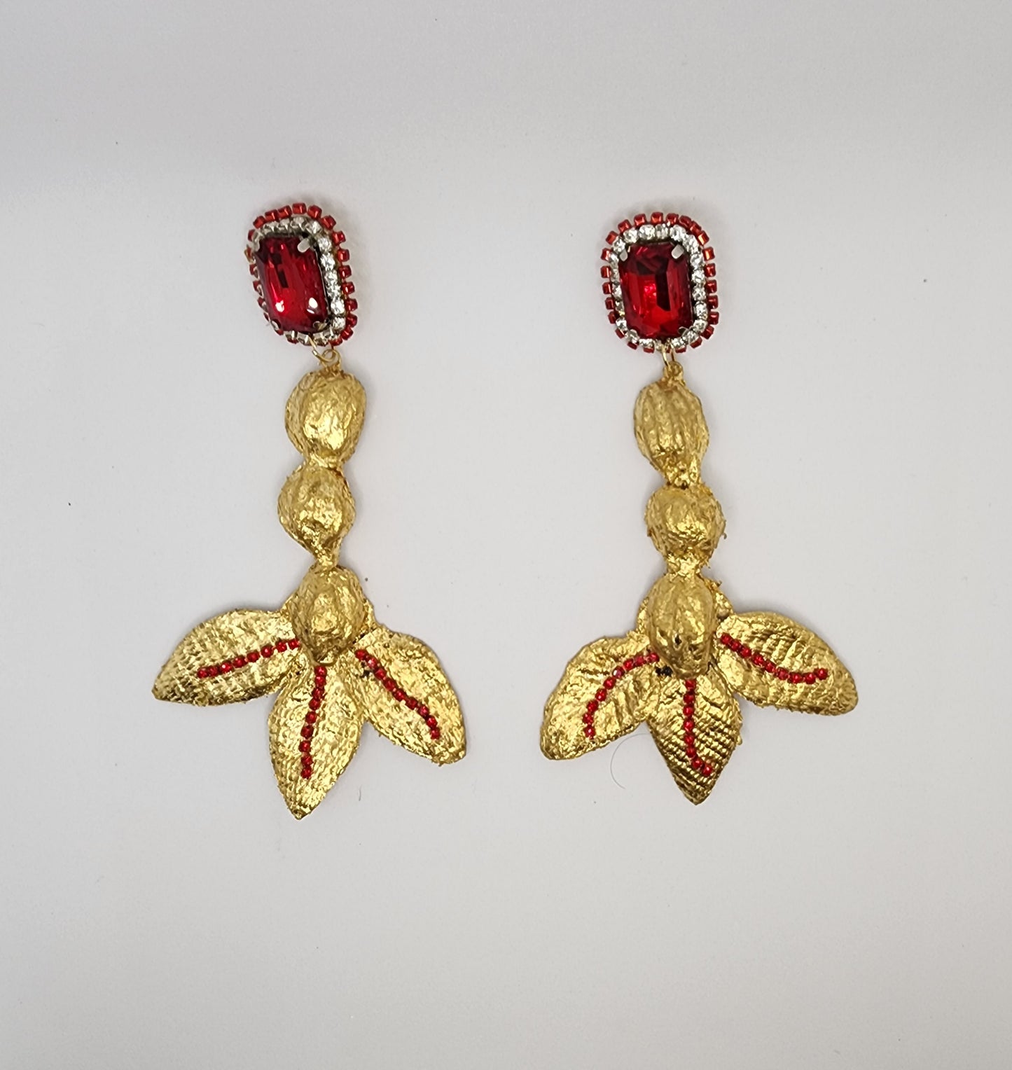 Gold Dangle Earrings with Red Crystals and Leaf Details