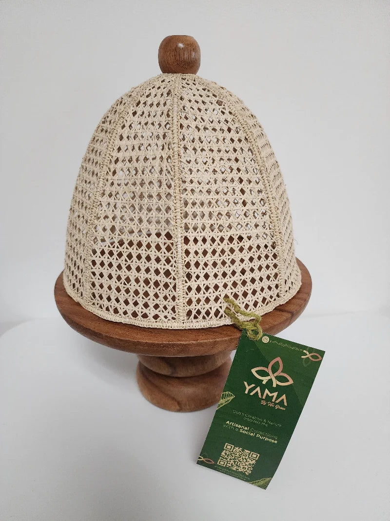 This handcrafted cake stand features a warm, caramel-toned wooden base, paired with a natural wicker cover.