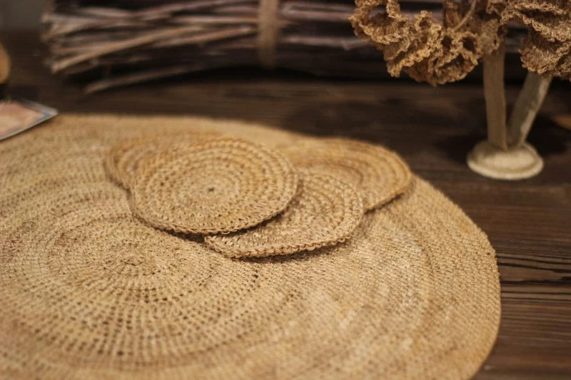 This set includes 6 handwoven banana tree fiber placemats, each paired with a matching glass coaster. Made by skilled artisans, the placemats showcase the natural beauty of banana tree fibers, offering both durability and eco-friendly elegance. Perfect for any dining occasion, this set adds a rustic, sustainable touch to your table setting.