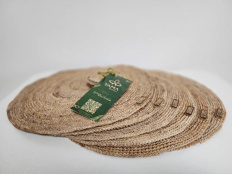 This set includes 6 handwoven banana tree fiber placemats, each paired with a matching glass coaster. Made by skilled artisans, the placemats showcase the natural beauty of banana tree fibers, offering both durability and eco-friendly elegance. Perfect for any dining occasion, this set adds a rustic, sustainable touch to your table setting.