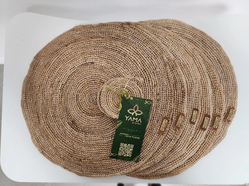 This set includes 6 handwoven banana tree fiber placemats, each paired with a matching glass coaster. Made by skilled artisans, the placemats showcase the natural beauty of banana tree fibers, offering both durability and eco-friendly elegance. Perfect for any dining occasion, this set adds a rustic, sustainable touch to your table setting.
