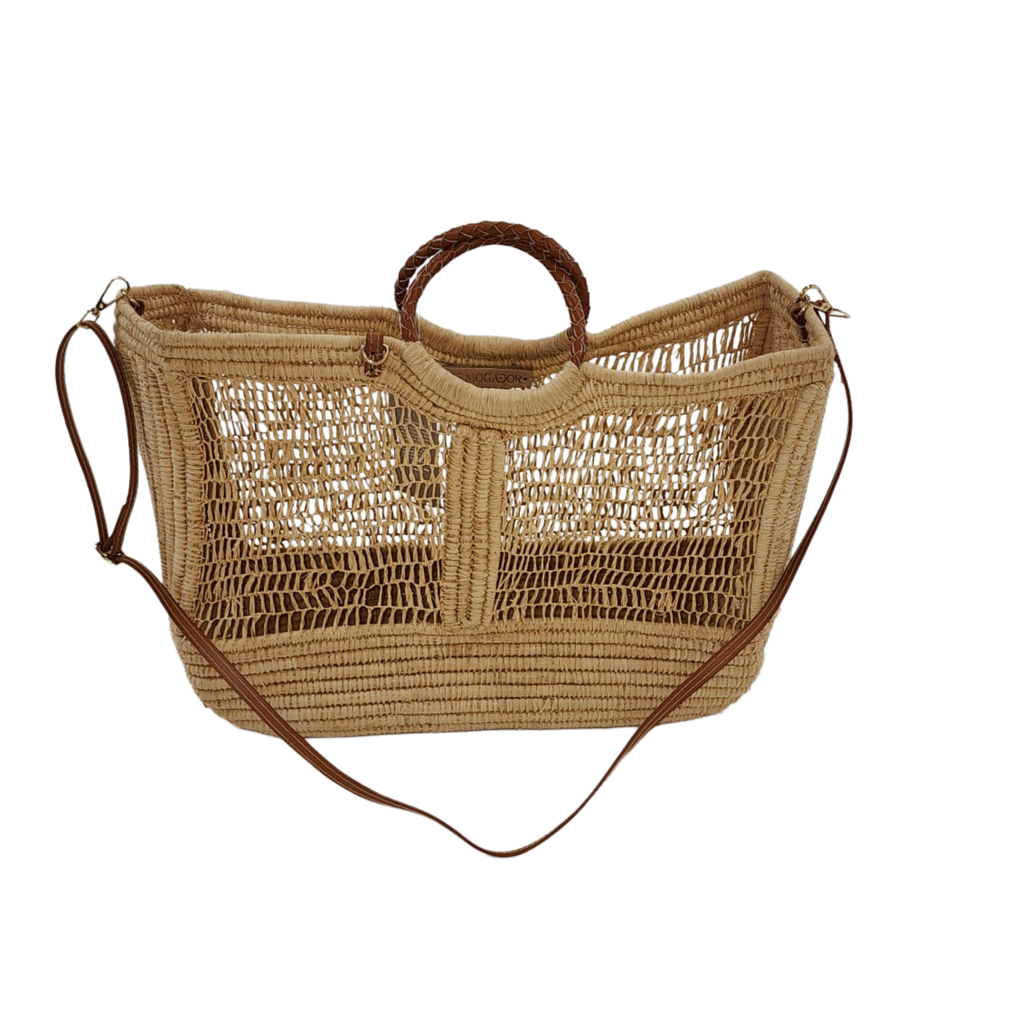 Handcrafted Enea Leather Beach Bag with open-weave design, leather handles, and shoulder strap on white background