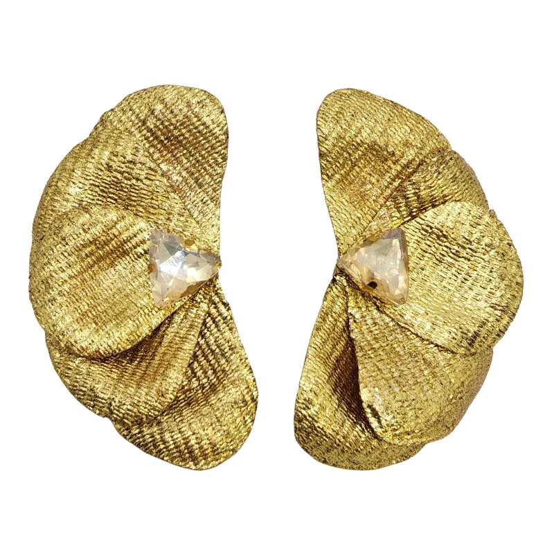 These exquisite handcrafted earrings, made from banana fiber, feature a stunning layered petal design with a radiant gold, silver or rose gold texture. A luminous triangular crystal at the center enhances their elegance, blending natural beauty with sophistication.

A timeless accessory that adds refinement to any look.