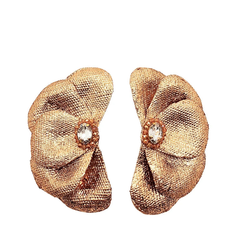These exquisite handcrafted earrings, made from banana fiber, feature a stunning layered petal design with a radiant gold, silver or rose gold texture. A luminous triangular crystal at the center enhances their elegance, blending natural beauty with sophistication.