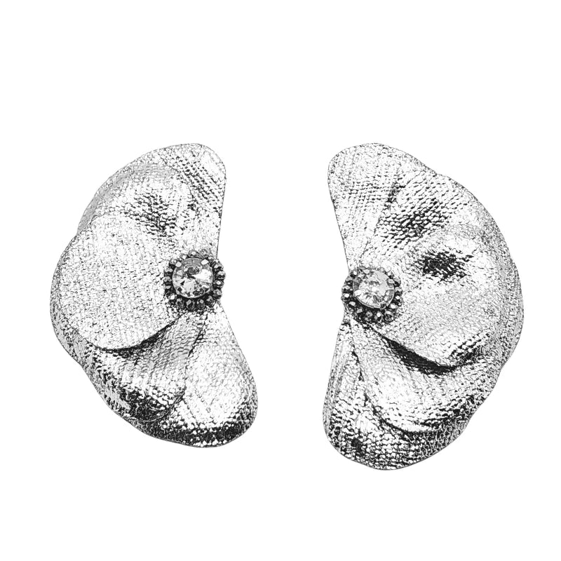 These exquisite handcrafted earrings, made from banana fiber, feature a stunning layered petal design with a radiant gold, silver or rose gold texture. A luminous triangular crystal at the center enhances their elegance, blending natural beauty with sophistication.

A timeless accessory that adds refinement to any look.