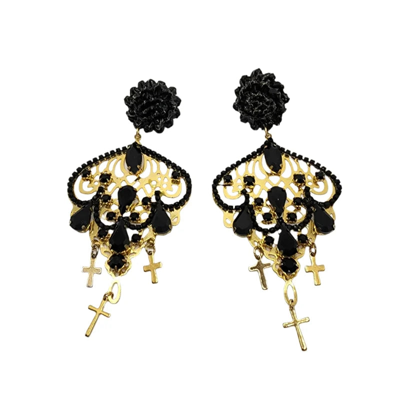 These handcrafted earrings feature delicate banana fiber flowers painted in black, beautifully complemented by golden cross designs and adorned with black gemstones.