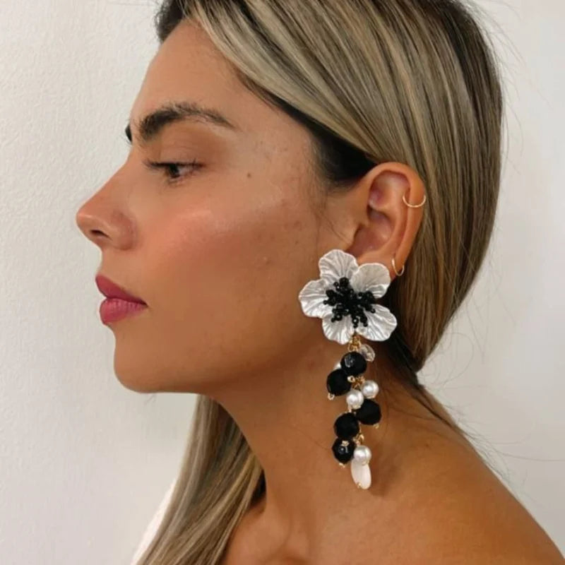Perfect for formal occasions or adding a sophisticated touch to any outfit, these earrings are a timeless blend of elegance and artistry.