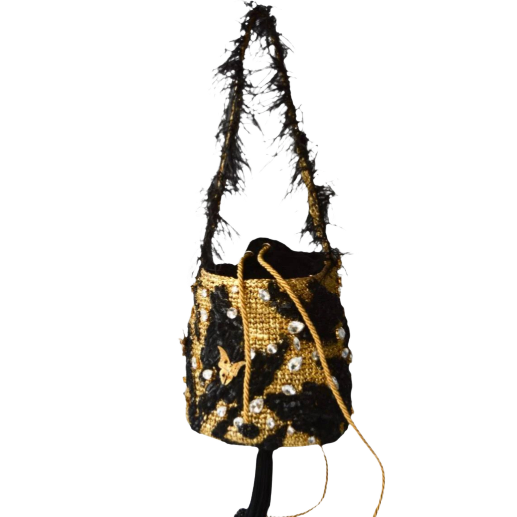 Black and gold minaudière bag with crystal embellishments, feathered strap, and gold drawstring, photographed on a white background.