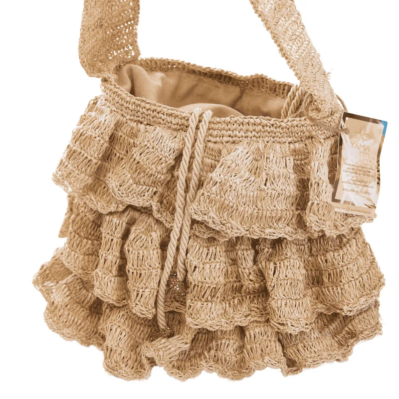 The Bolero Bag is a medium-sized handcrafted accessory designed for everyday elegance. Made from sustainable banana tree fibers, it highlights the beauty of raw materials with a naturally textured finish and thoughtful artisanal details.