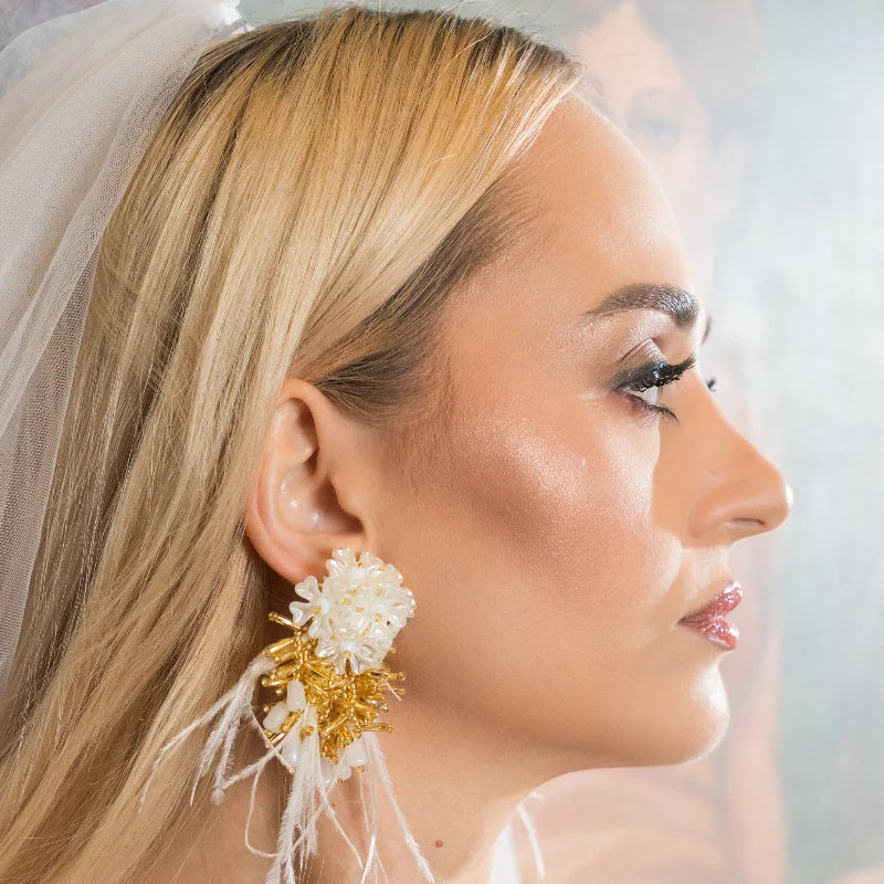 Perfect for the contemporary bride, these handcrafted earrings feature exquisite detail that enhances your wedding look with timeless luxury and sophistication