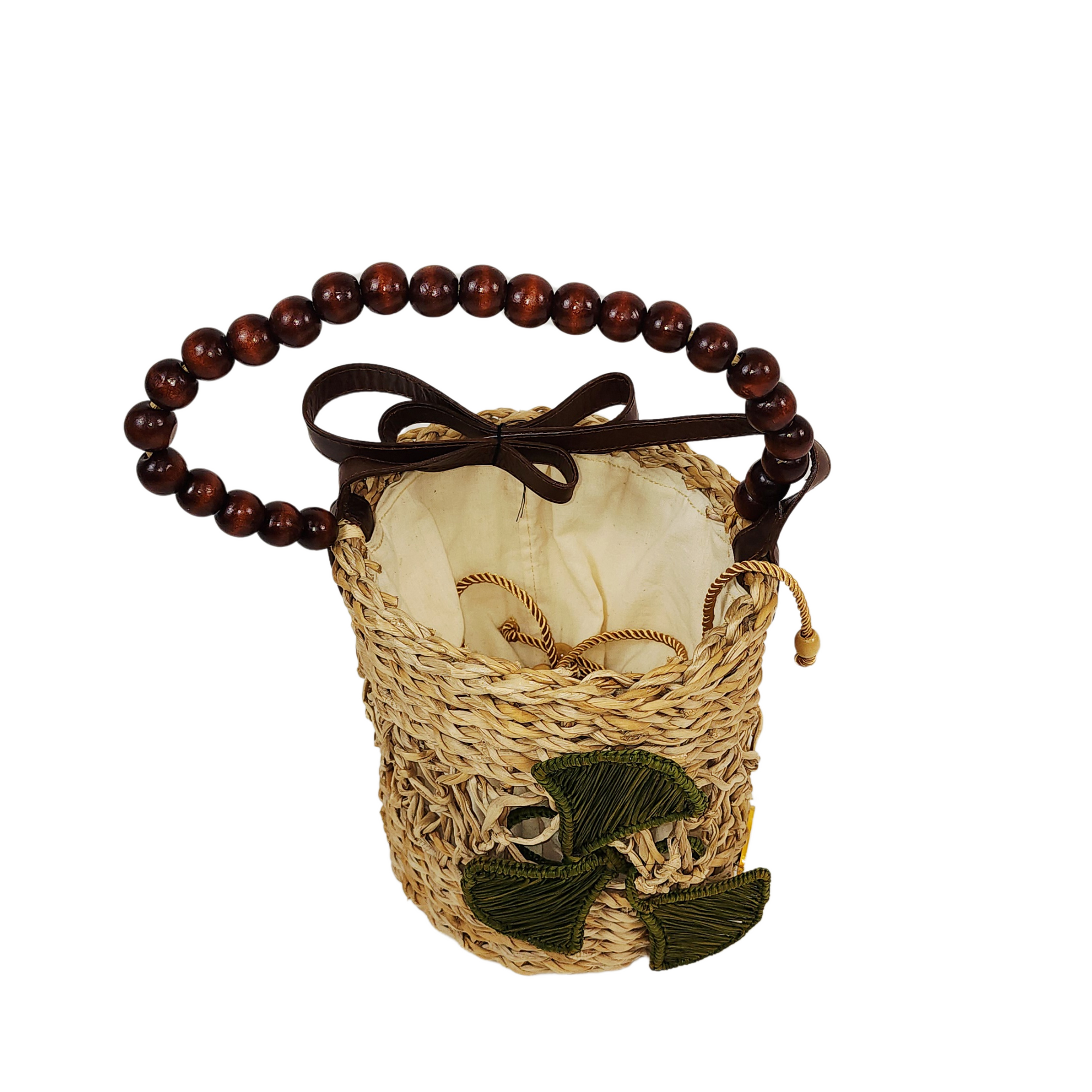 Bucket Flower Bag with green woven flower detail and circular wooden beaded handle on white background