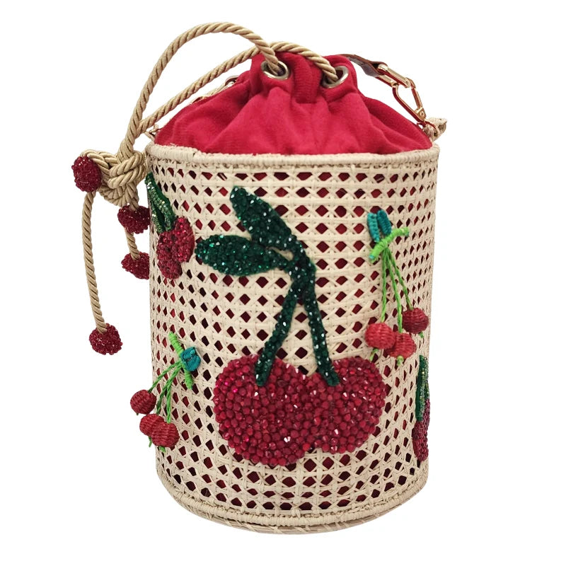 Crafted with exquisite detail, the Cherry Bag is made from handwoven banana fiber and features a charming cherry design made from red and green beads