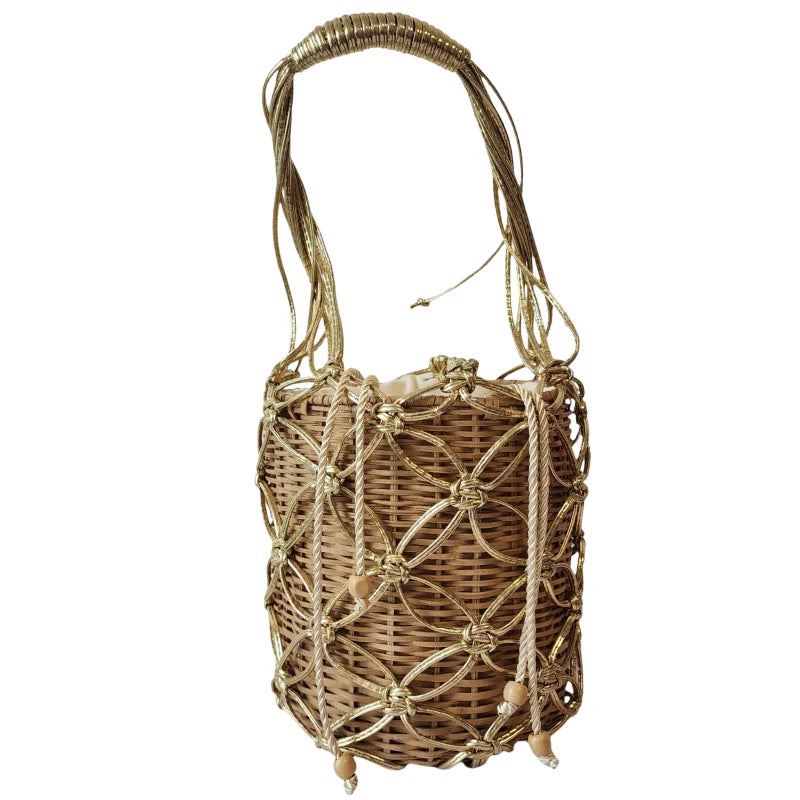 This handcrafted bag is made from durable wicker fiber and features delicate hand-embroidered flowers accented with golden ribbon.