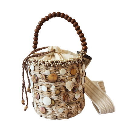 Handcrafted Pearl Coral Bag made of wicker with pearl and shell detailing and a wooden handle