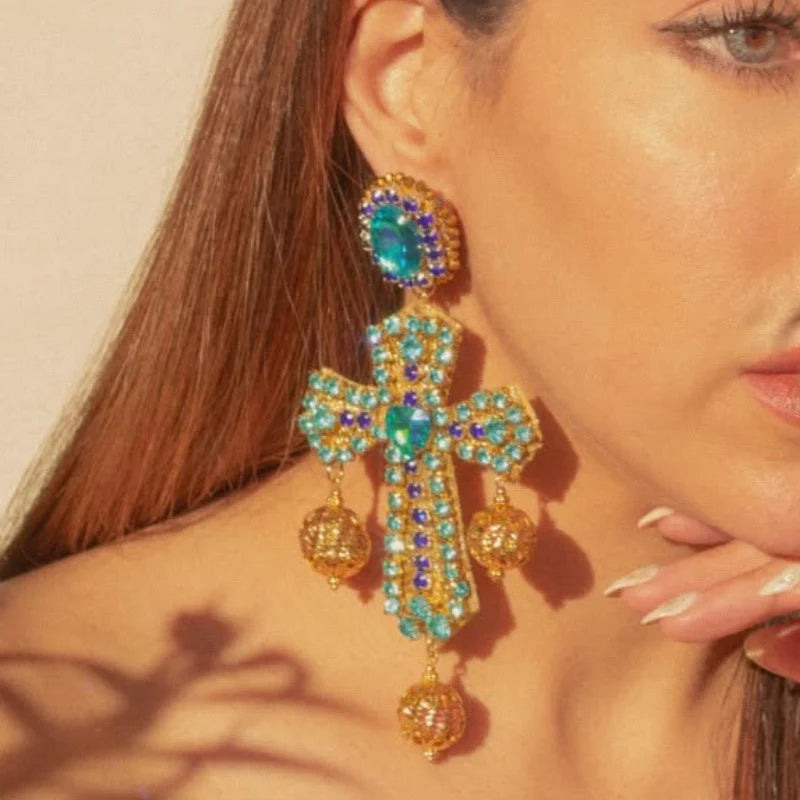 Experience divine elegance with our Handcrafted Cross Earrings, featuring vibrant Murano stones and luxurious fine jewelry accents. 