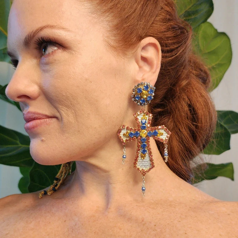 Experience divine elegance with our Handcrafted Cross Earrings, featuring vibrant Murano stones and luxurious fine jewelry accents. 
