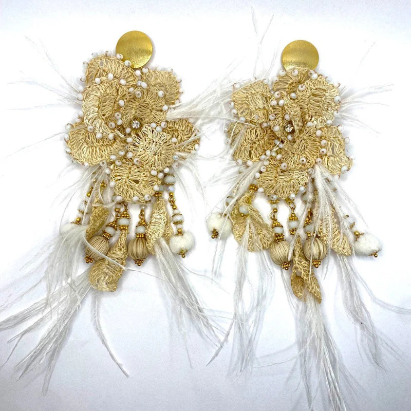 Dangling Delicate feathers . Handcrafted with the Banana Tree Fibers.