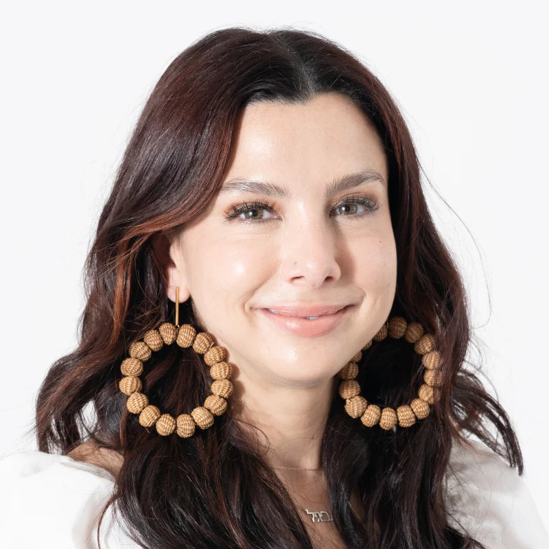 These large bead earrings dangle elegantly in a circular shape, beautifully combined with fine jewelry accents. Handmade with natural Banana Tree Fibers, they are stunningly decorated with carefully selected beads.