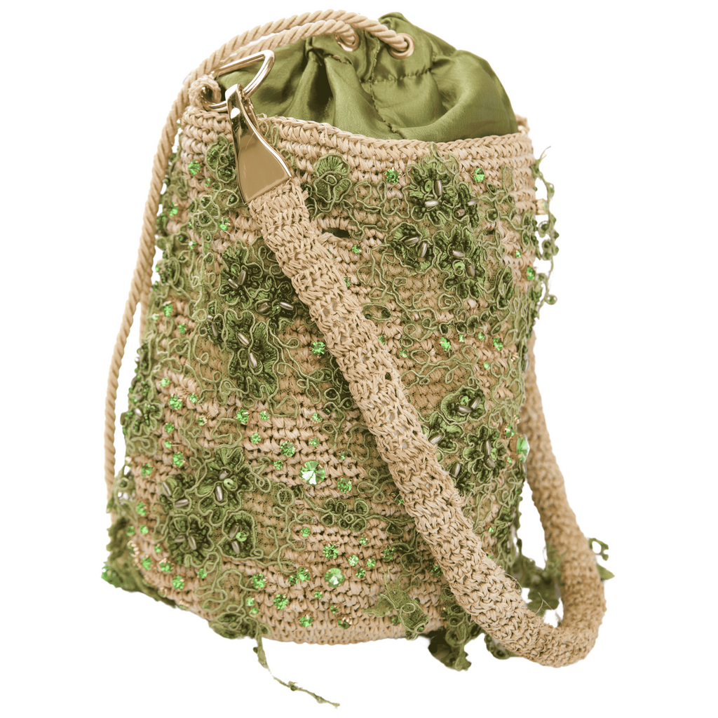 Handcrafted crossbody bag made from natural fibers with green floral embroidery, green satin lining, and gold-tone hardware