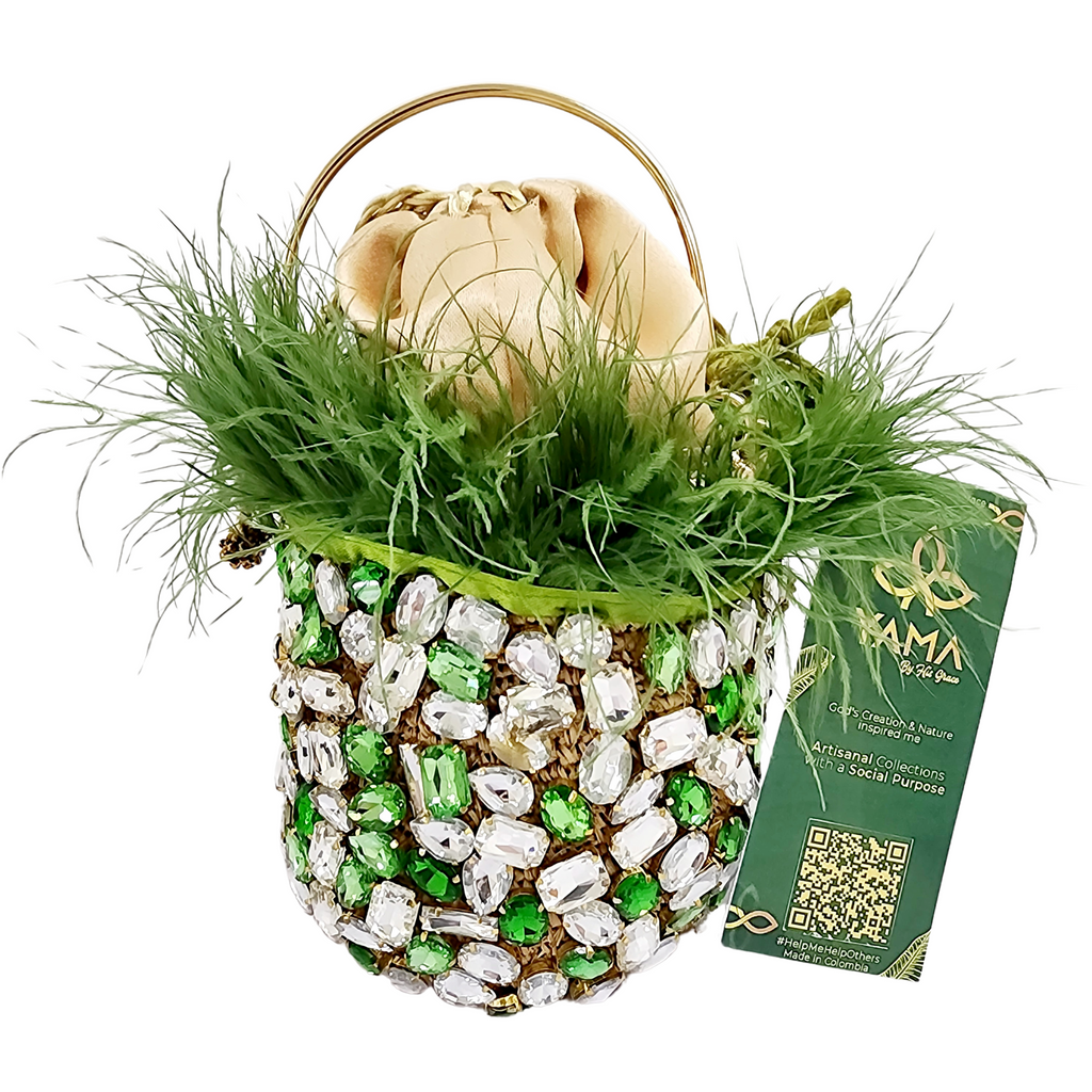 Emerald green and crystal minaudière bag with feather trim, gold handle, and Yama by His Grace tag on a white background.