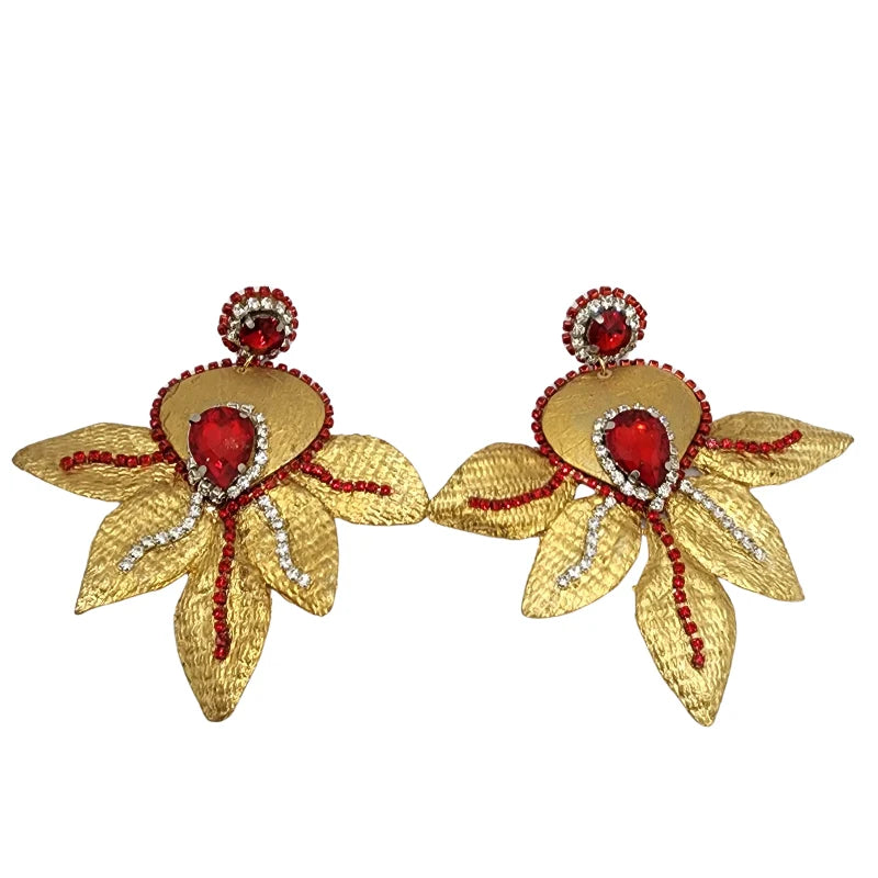 gold-toned earrings feature an intricate floral-inspired design with extended petal-like shapes for an elegant,