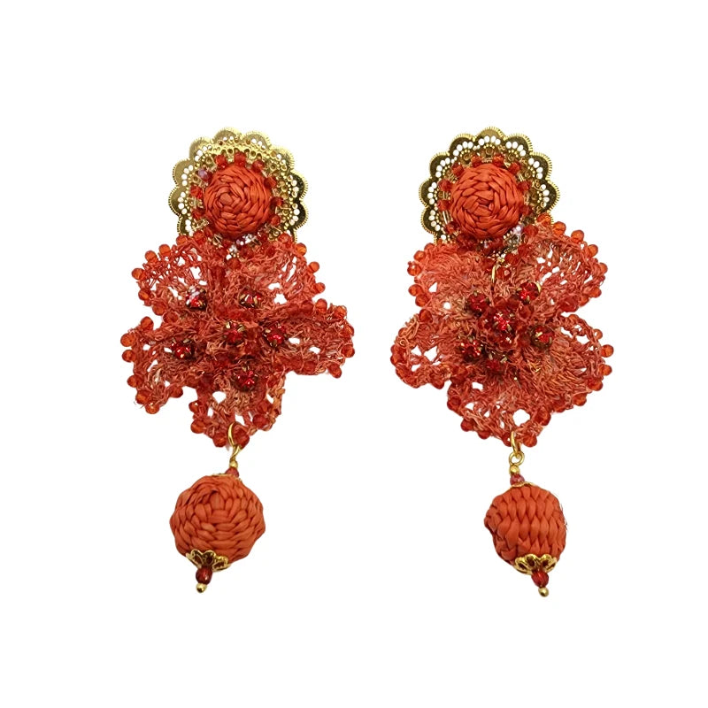 Flame Petal Earrings with orange threadwork petals, red beads, and woven drop charm — handcrafted bold floral jewelry