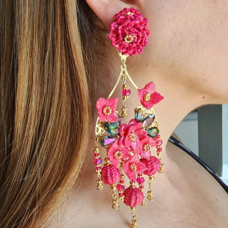 woman wearing statement earrings