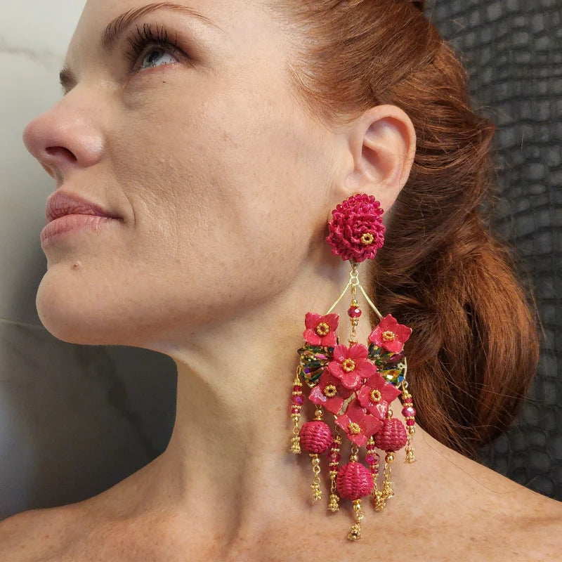 woman wearing statement earrings