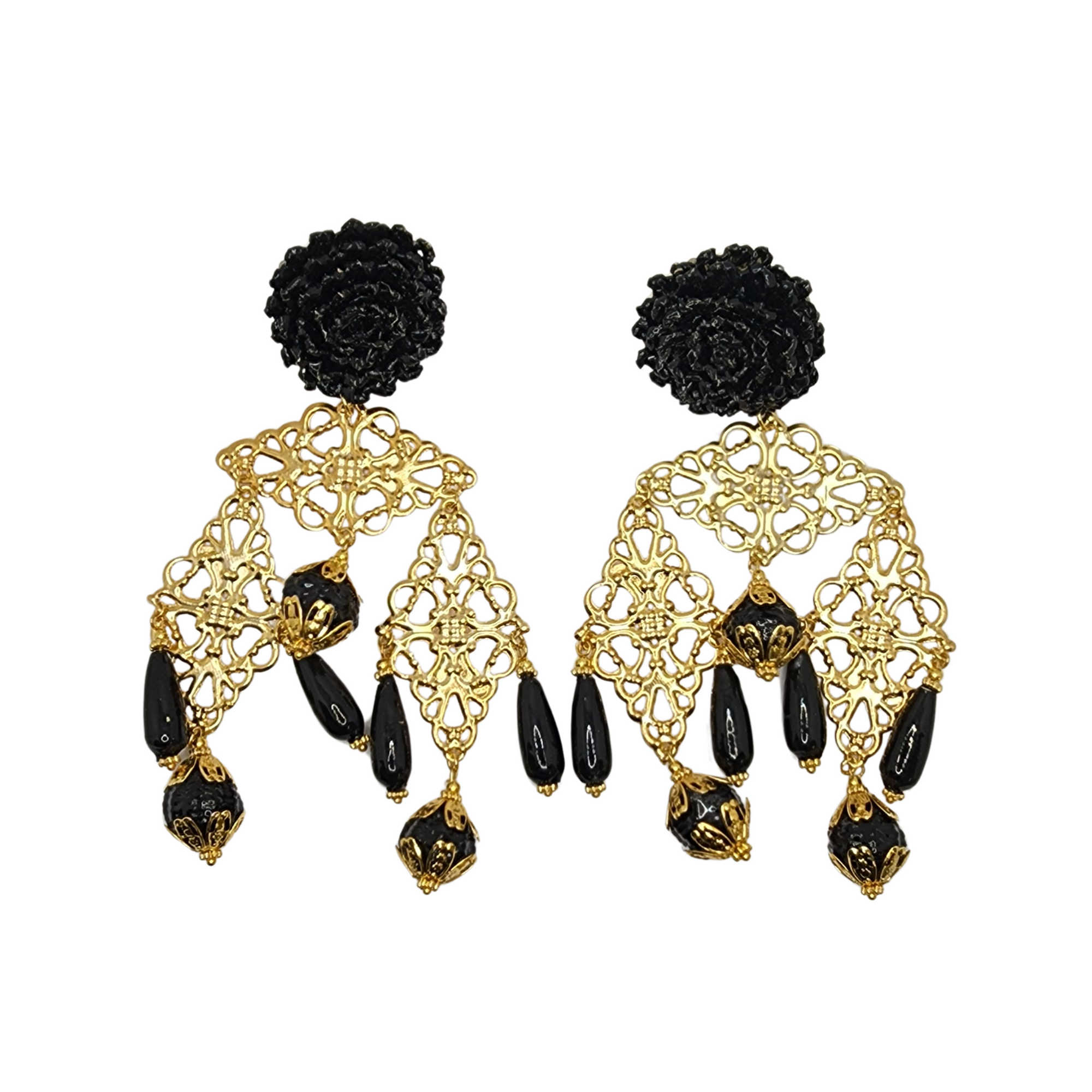 Black and gold earrings with a woven floral stud, ornate gold filigree, and bold black dangling beads.