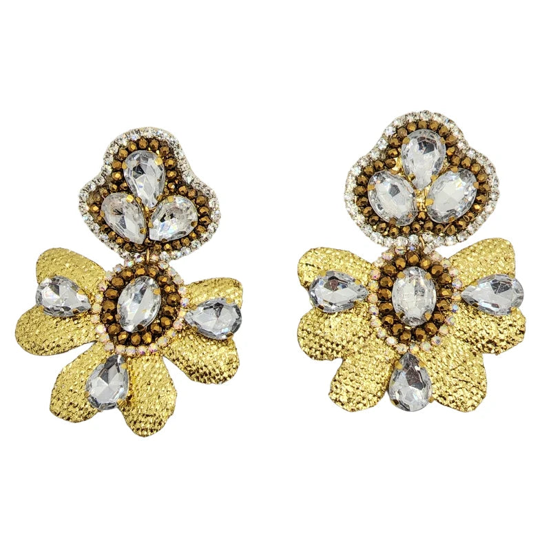 A pair of flower-shaped earrings adorned with crystal gemstones and crafted from banana fiber, available in gold and silver colors.