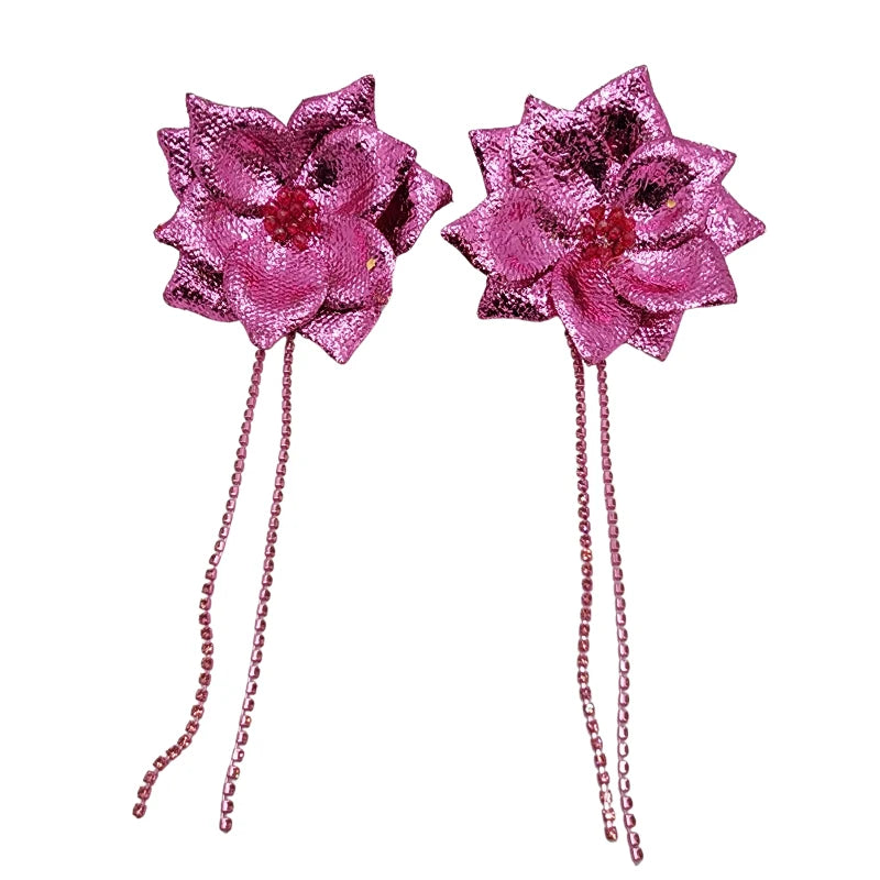 Fucsia_Blossom_Earrings are a bold and vibrant statement piece, handcrafted with fuchsia-colored petals and adorned with sparkling accents. These earrings feature delicate beaded chains that enhance their elegant design.