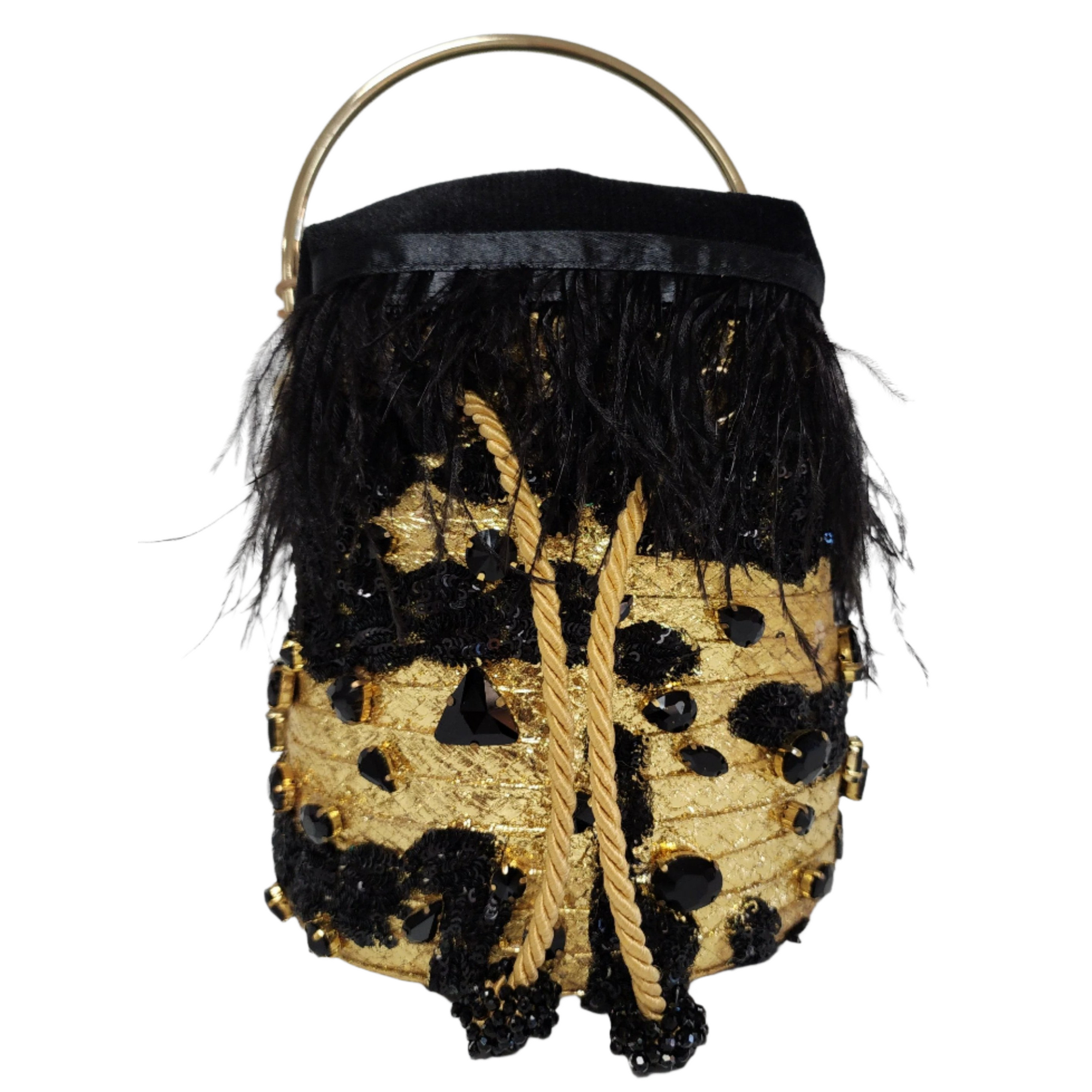 Handcrafted minaudiere bag with gold sequins, black feather trim, and black gemstone accents on a white background