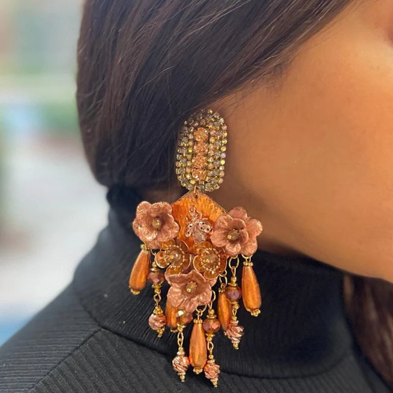 woman wearing statement earrings