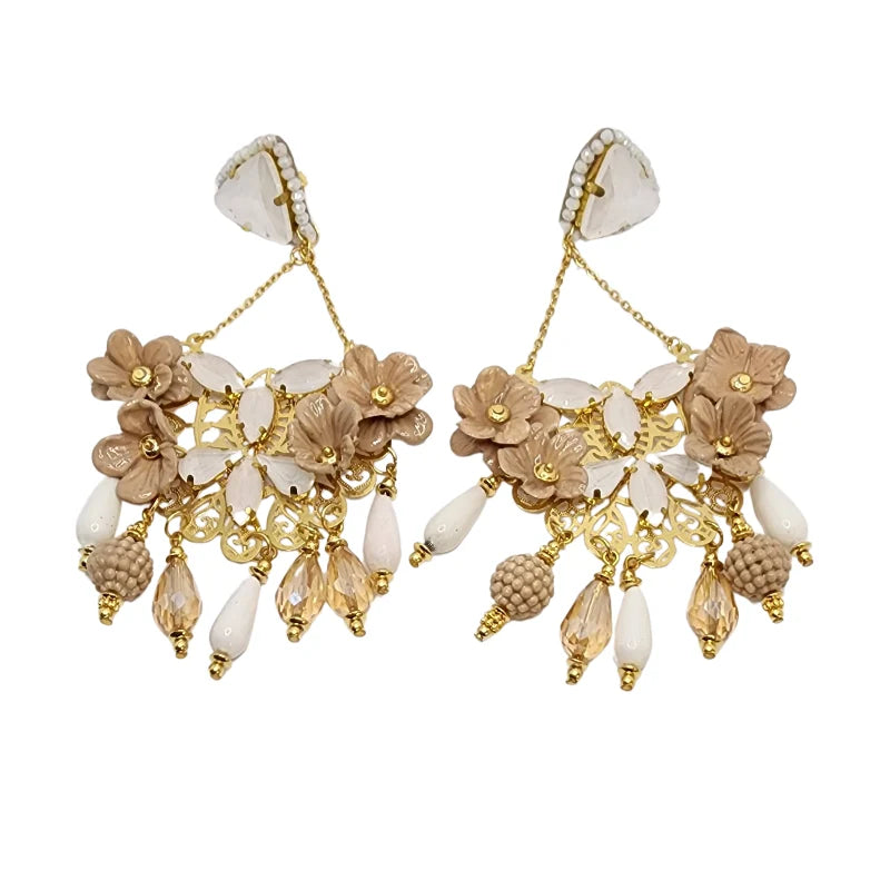 Embrace elegance with these exquisite chandelier earrings featuring intricate floral motifs in soft beige and gold tones