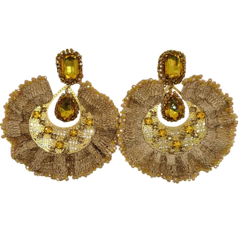 These exquisite earrings are shaped like a ruffled leaf, beautifully decorated with vibrant Murano stones at its base and fine jewelry accents in the center. Handmade with Banana Tree Fibers, these earrings exude elegance with their sparkling, shiny appearance. 