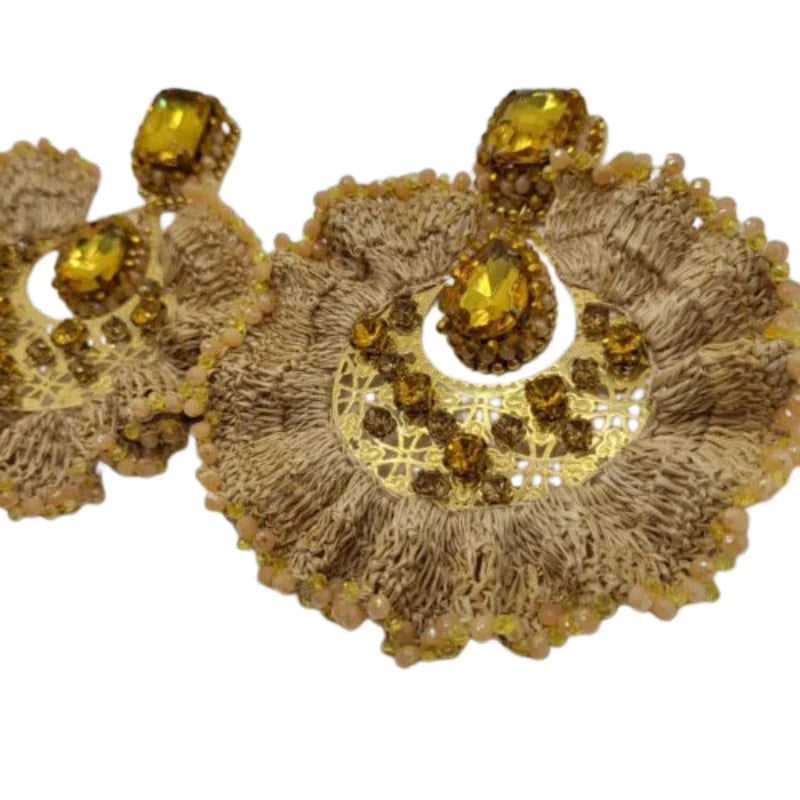 These exquisite earrings are shaped like a ruffled leaf, beautifully decorated with vibrant Murano stones at its base and fine jewelry accents in the center. Handmade with Banana Tree Fibers, these earrings exude elegance with their sparkling, shiny appearance. 
