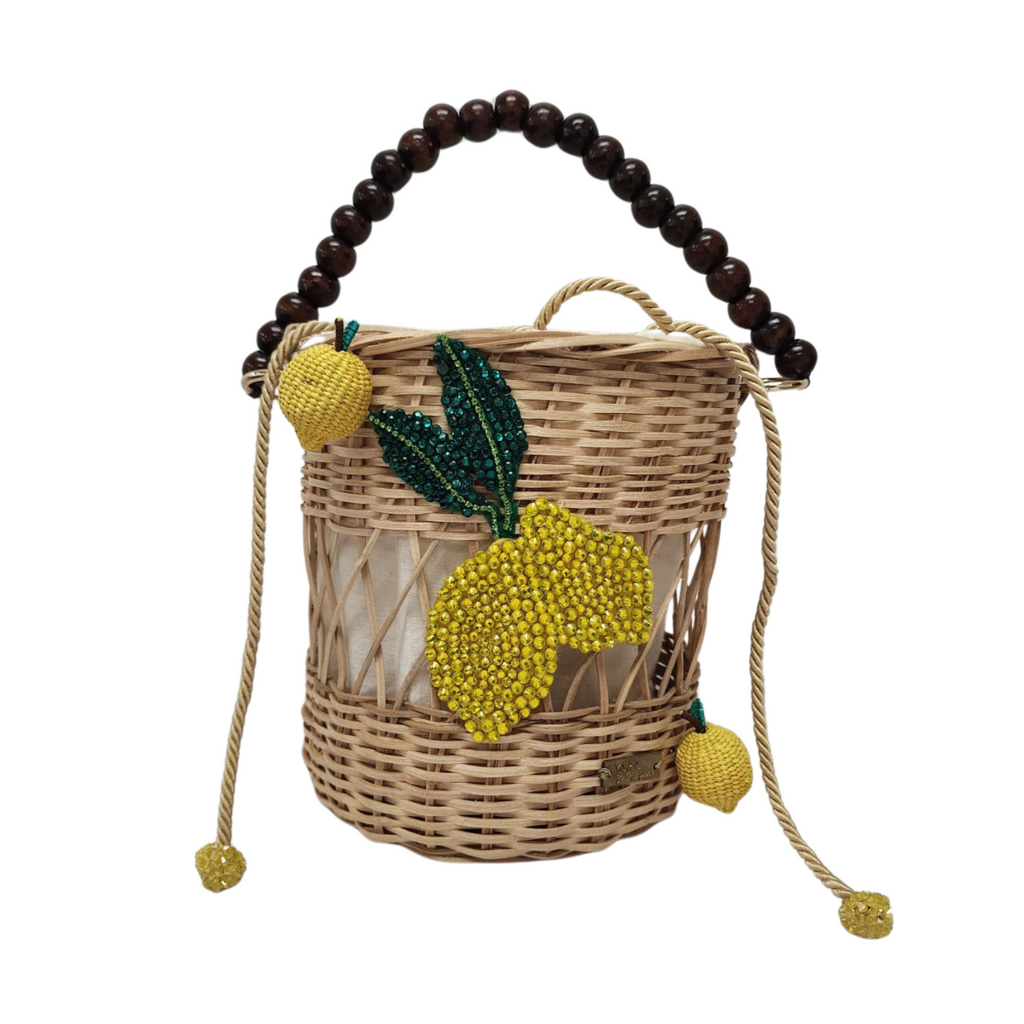 Lemon Delight Handbag with beaded lemon motif, natural fiber weave, and dark wooden handle on white background