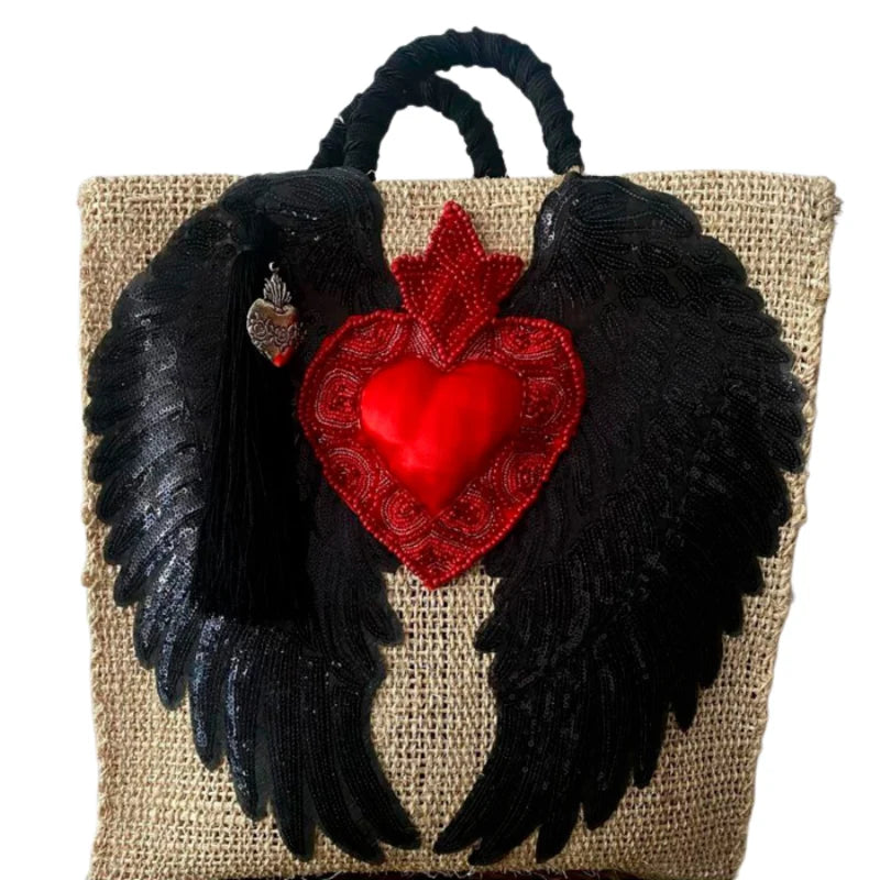 Discover the charm of Mexican Handcrafted Bags, designed by skilled artisans to celebrate Mexico’s rich cultural heritage. These bags feature intricate embroidery with hearts, angel wings, and meaningful quotes, brought to life with vibrant colors and detailed patterns. Spacious interiors and durable craftsmanship make them perfect for daily use or special occasions.