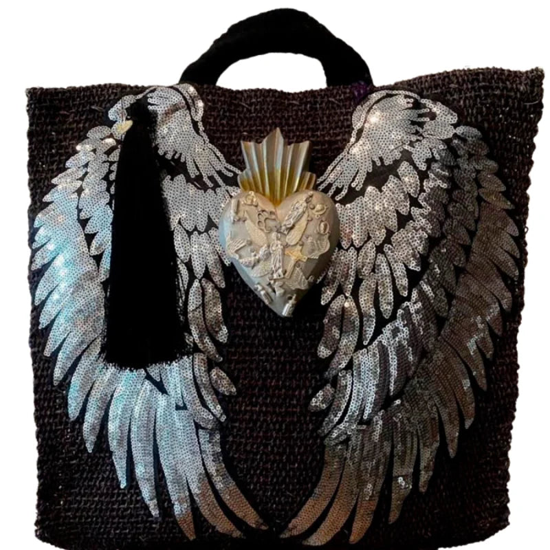 Discover the charm of Mexican Handcrafted Bags, designed by skilled artisans to celebrate Mexico’s rich cultural heritage. These bags feature intricate embroidery with hearts, angel wings, and meaningful quotes, brought to life with vibrant colors and detailed patterns. Spacious interiors and durable craftsmanship make them perfect for daily use or special occasions.