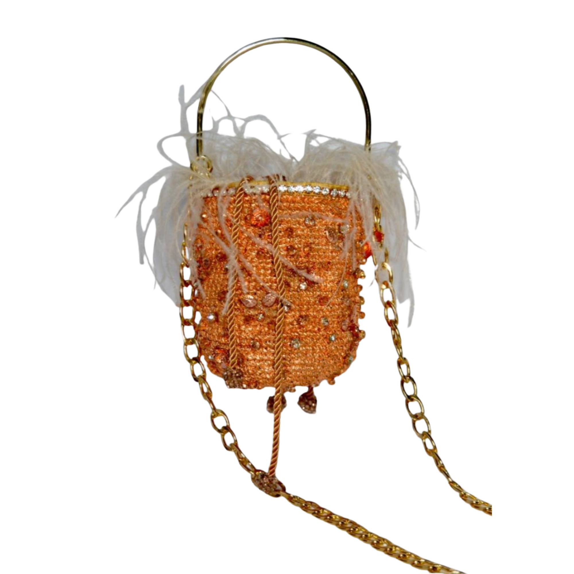 Rose gold bag with white feathers and gold chain strap shown from the side on white background