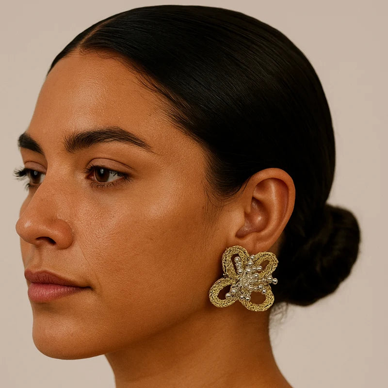 featuring handwoven loops accented with silver beads