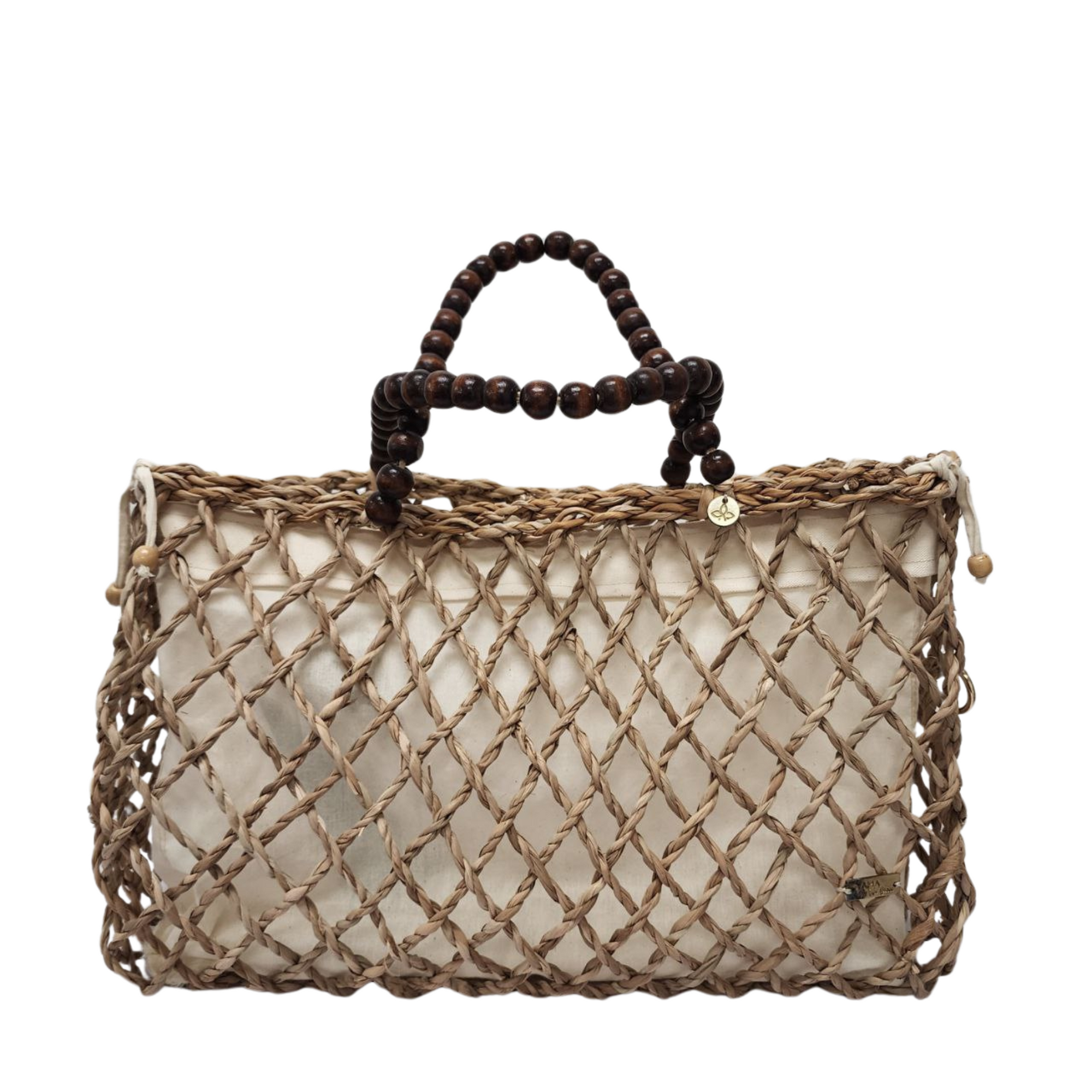 Natural woven tote bag with wooden bead handles against white background