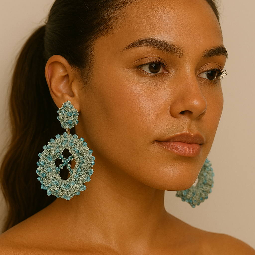Model wearing Oval Light Blue Embroidery Earrings with banana fiber and light blue gemstones — handcrafted statement piece