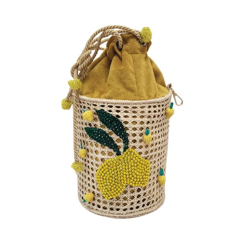 Handcrafted Limoncello Bag with woven natural base, crystal lemon embroidery, and yellow pompom drawstring