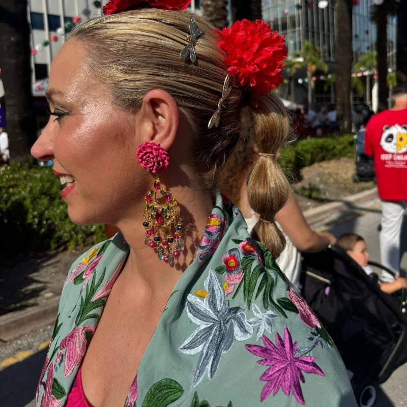 woman wearing statement earrings