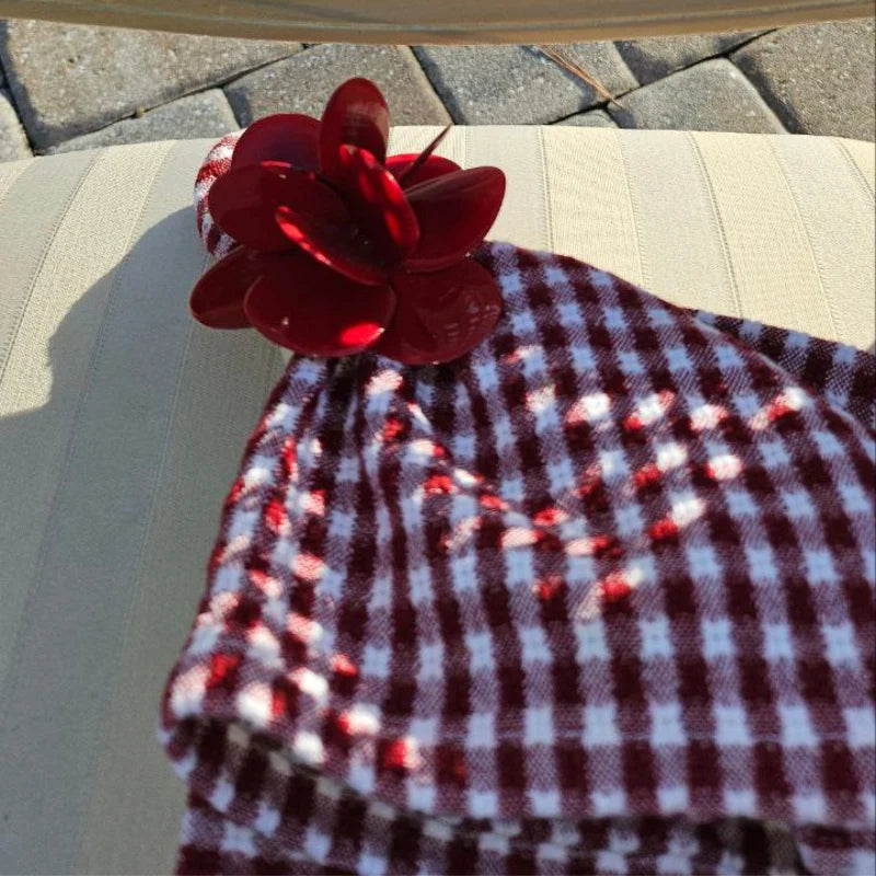 The Scarlet Petal Napkin Ring brings a touch of elegance and artistry to your table setting.