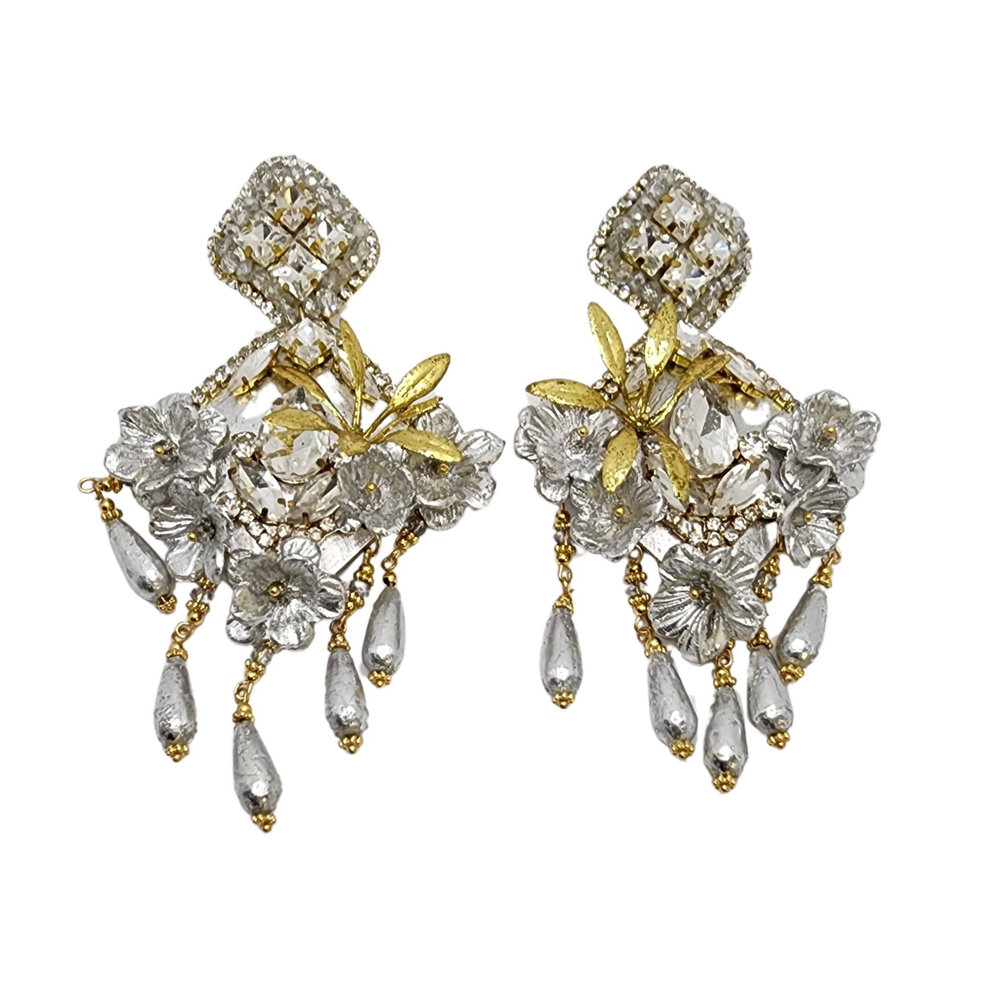 Handcrafted silver and gold statement earrings with floral motifs, crystal accents, and delicate dangling beads.