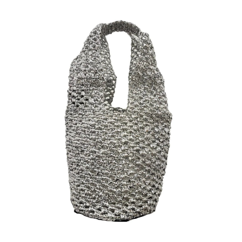 Silver recycled tote bag made from chip bag wrappers, featuring a handcrafted textured finish and structured shape