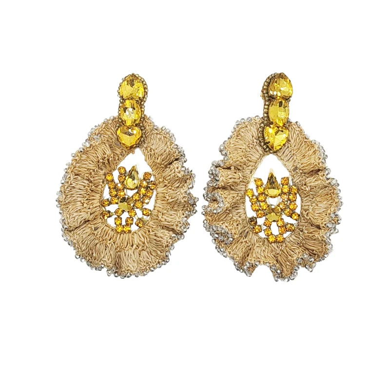 These elegant earrings feature a ruffled leaf design adorned with colorful Murano stones at the base and fine jewelry at the center.